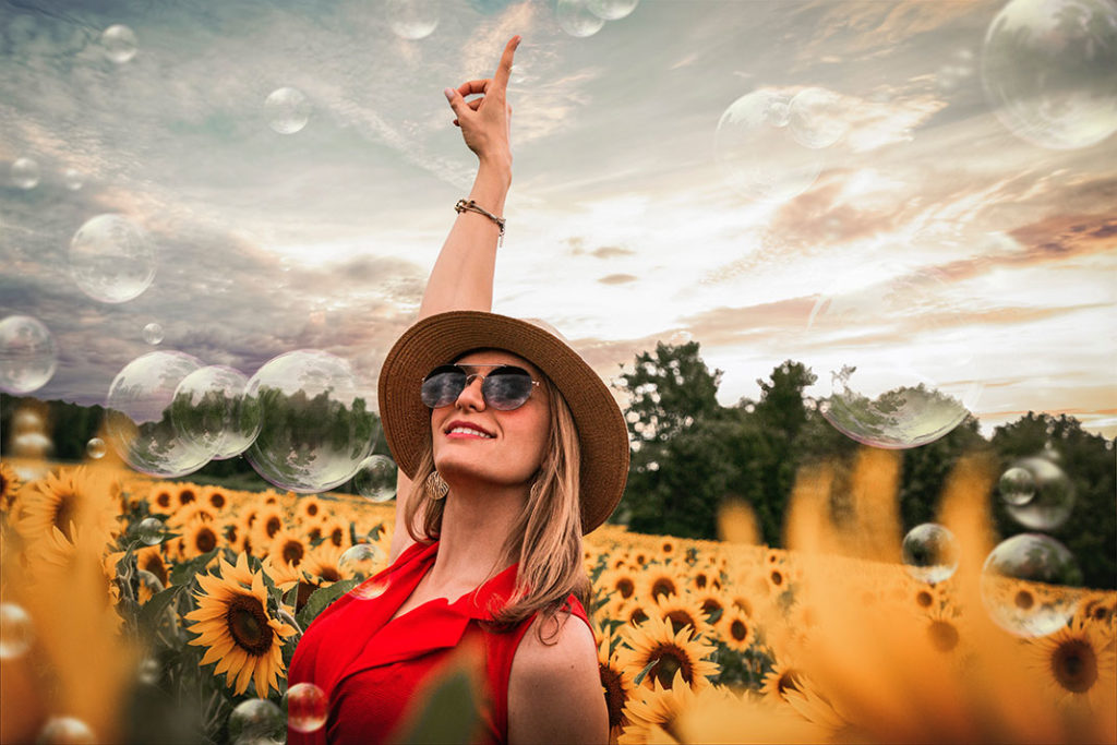 woman in a field of sunflowers