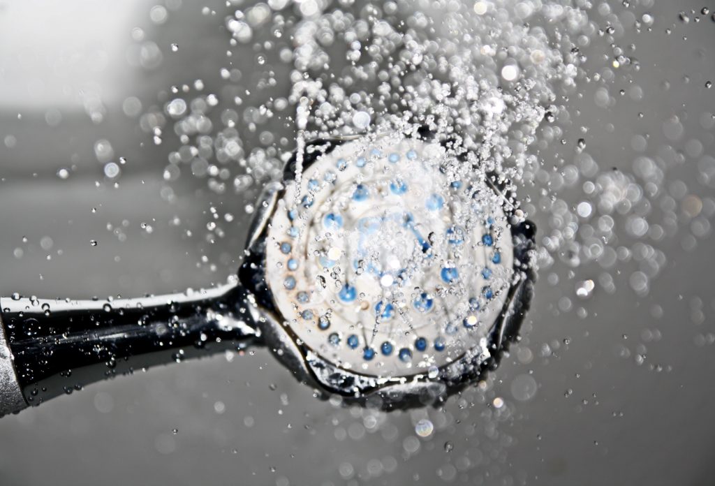 cold water gushes out of the shower head
